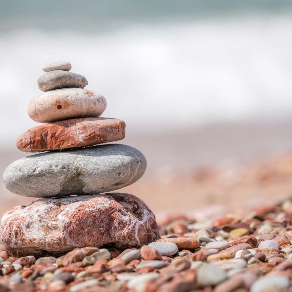 zen-balanced-small-pile-of-stacked-stones-GR5MQKW.jpg